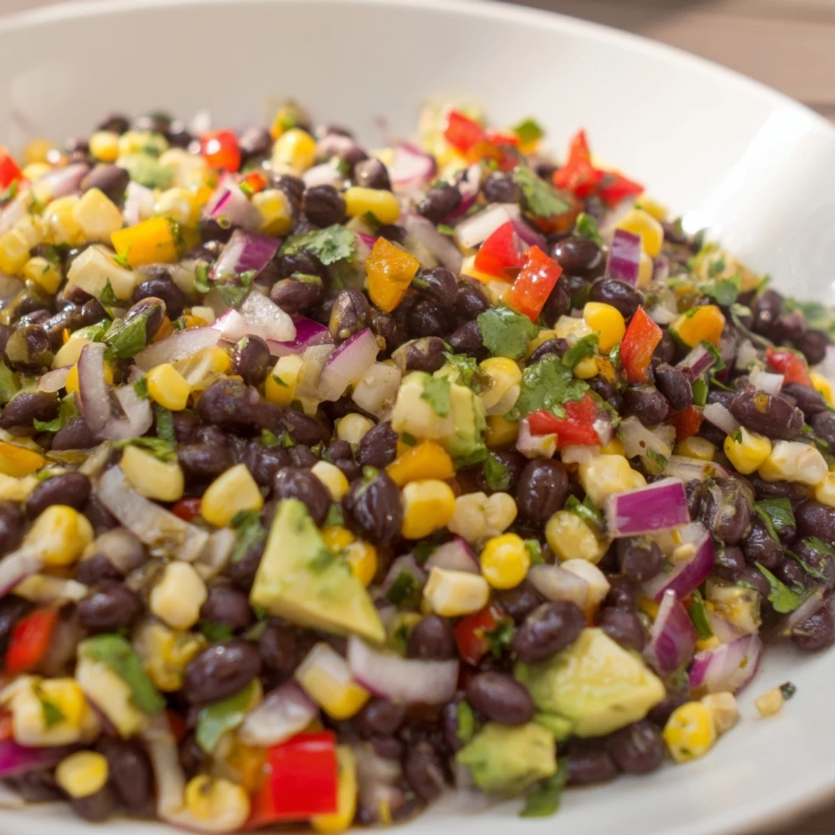 Vibrant Southwest Black Bean Salad with colorful bell peppers and a zesty lime dressing.