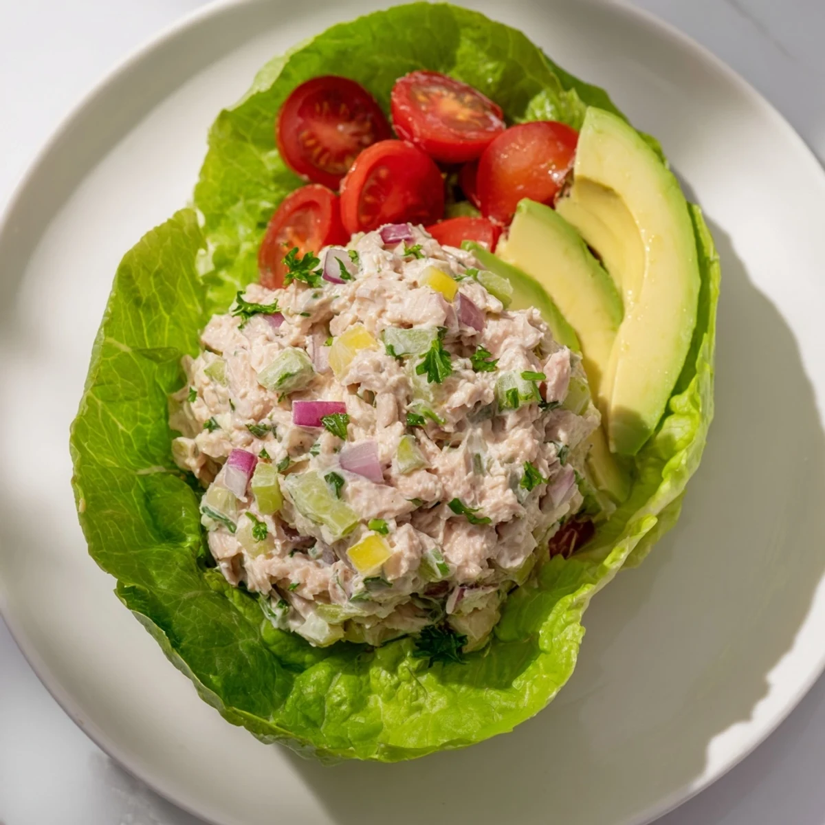 Fresh tuna salad lettuce wraps, filled with creamy tuna, ready for a delicious, light lunch.