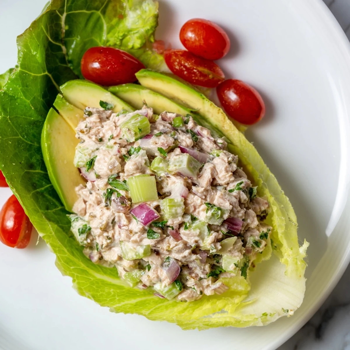 Bright photo of tuna salad lettuce wraps, featuring fresh lettuce cradling a flavorful tuna filling.