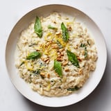 A close-up shot of rich and creamy 15-Minute Pesto Risoni, garnished with fresh basil leaves.