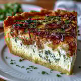 Spring Brunch Quiche with Leeks and Gruyere, a golden custard tart with buttery leeks and melted Gruyere, perfect for a spring brunch spread.