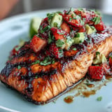 Delicious grilled salmon fillets topped with a refreshing strawberry avocado salsa for a healthy, colorful meal.  