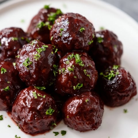 Mouthwatering view of slow cooker cherry BBQ meatballs, a sweet and savory party appetizer made easy.