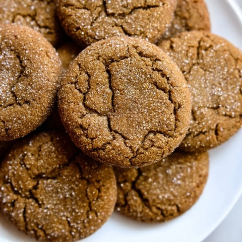 Warm, spiced Express Gingerbread Latte Cookies, golden brown and sprinkled with sugar, ready to eat.