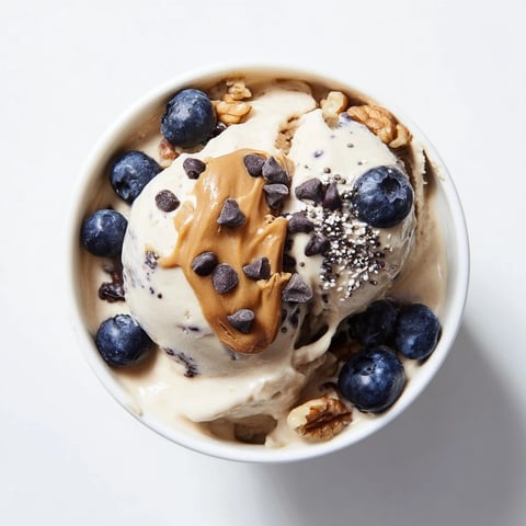 Creamy Protein Ice Cream Bowl with fresh berries, perfect healthy snack after a workout.