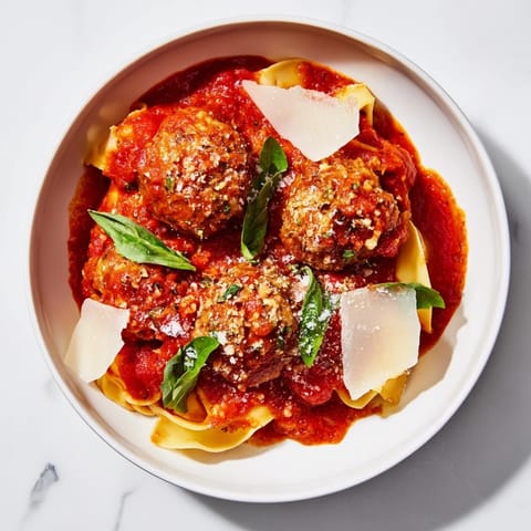 One-pan Italian Meatball Pasta Skillet featuring tender meatballs nestled in a rich, tomato-based sauce, ready to serve.
