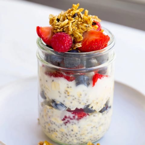 A close-up of creamy Overnight Oats, beautifully layered with fruit and nuts for a satisfying morning meal.