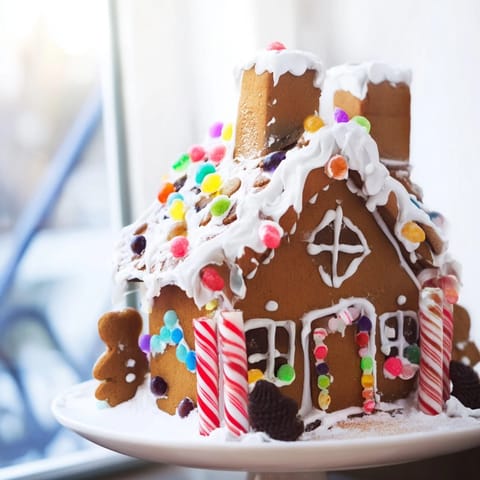 This vibrant gingerbread house recipe offers sturdy, homemade panels with colorful candy details.