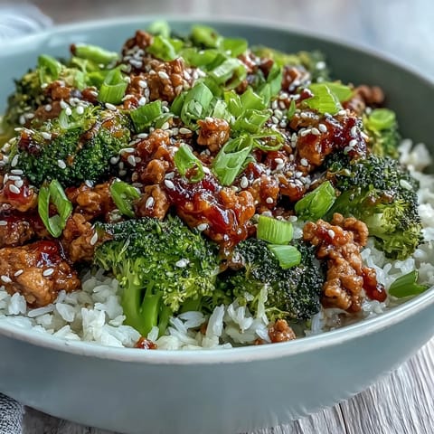 Steamed bright green broccoli florets and sesame seeds top this easy Asian-inspired weeknight dinner bowl.