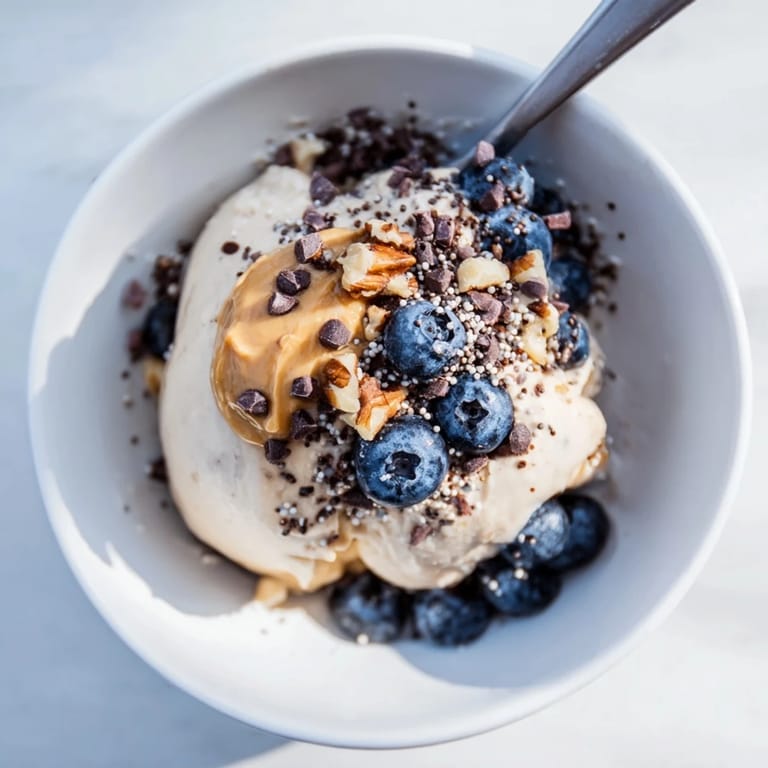 Enjoy this delicious, homemade Protein Ice Cream Bowl, customizable and easily made with a blender.