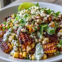 Mexican Street Corn Salad with creamy Cotija cheese and zesty lime dressing, perfect for summer barbecues and picnics.  