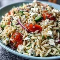 Refreshing summer orzo salad loaded with feta and bright lemon dressing.